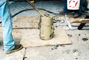 The photo shows the belling tool that is used to hollow out a bell shape that will be filled with concrete and become the foot of the Bell Bottom Pier.