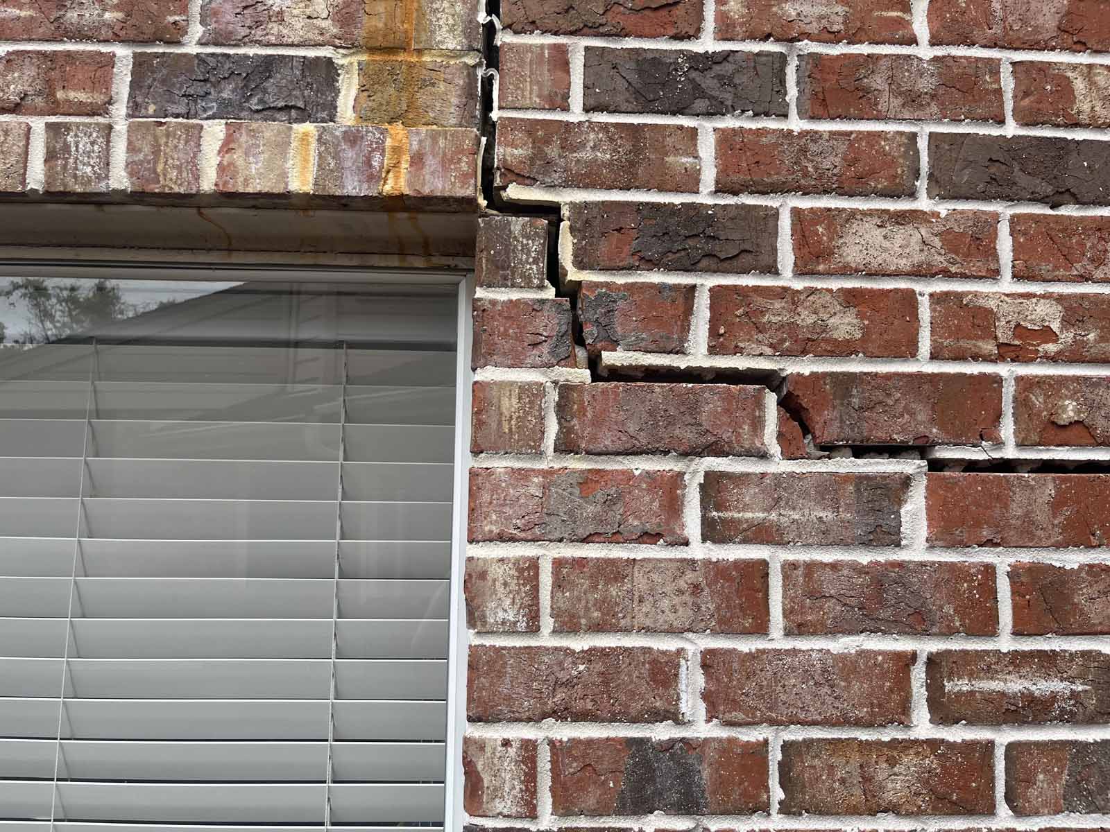 Soil movement moves and cracks slab foundations which in turn causes cracks in the exterior brick wall.